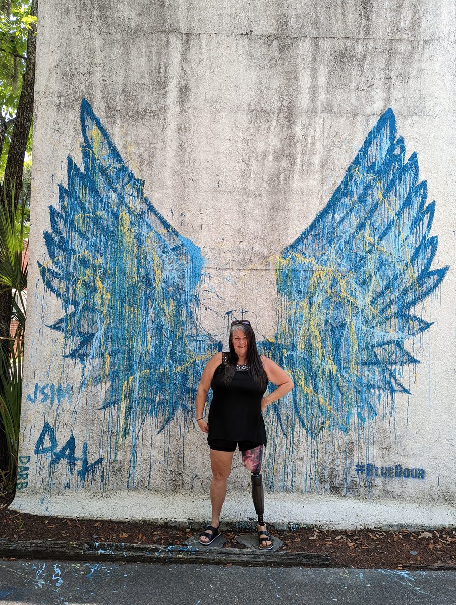Marley Gibson standing in front of angel wings mural in Savannah