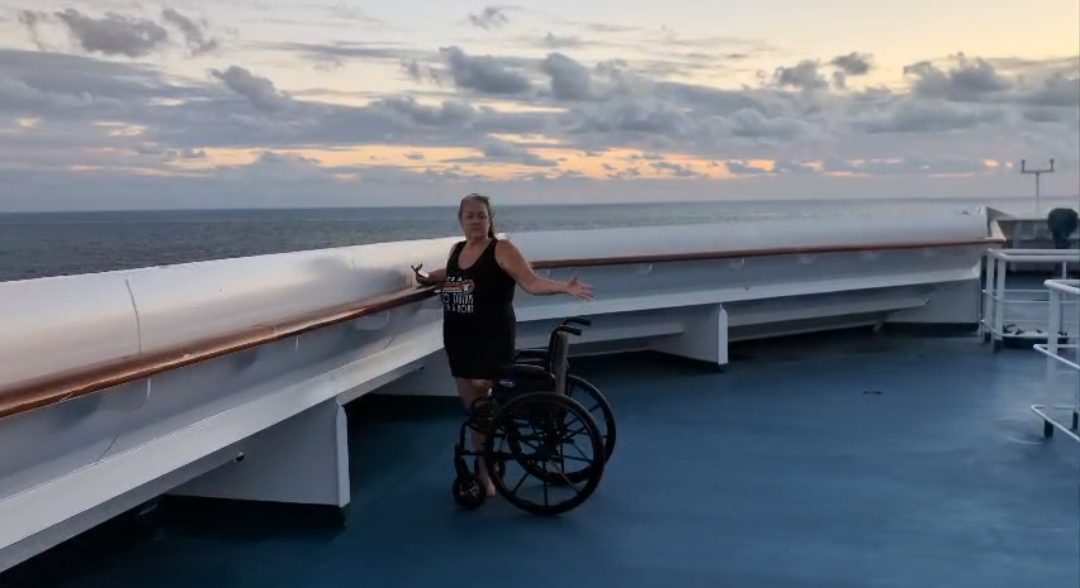 Marley Gibson on a cruise ship deck at sunset